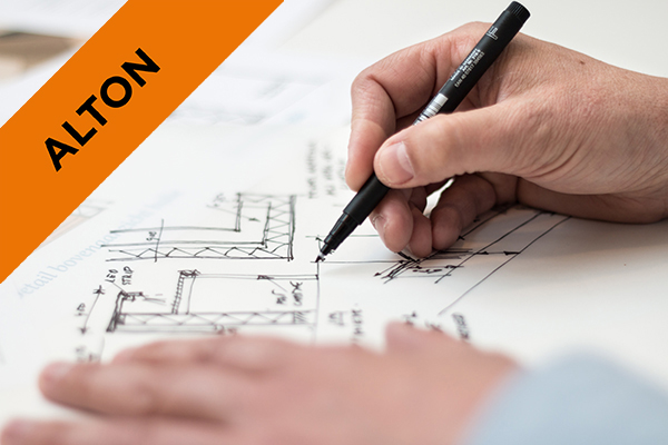 someone drawing up designs