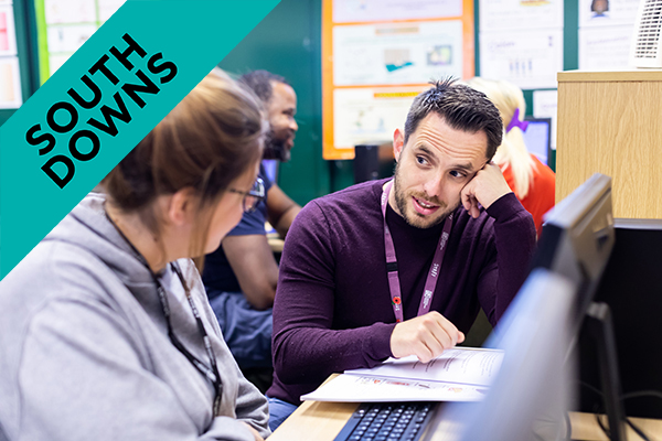 Lecturer talking to a student on their Access to HE Diploma in Health Science course.
