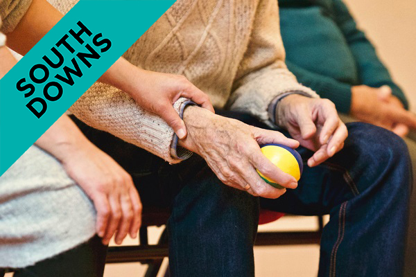 someone holding an elderly persons hands