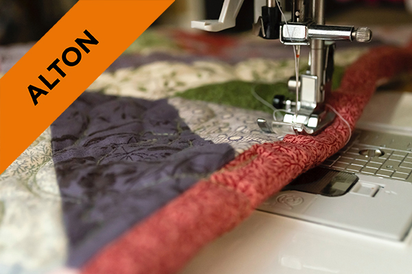 Close up of fabric going through a sewing machine during the A Level Textiles course at Alton Campus