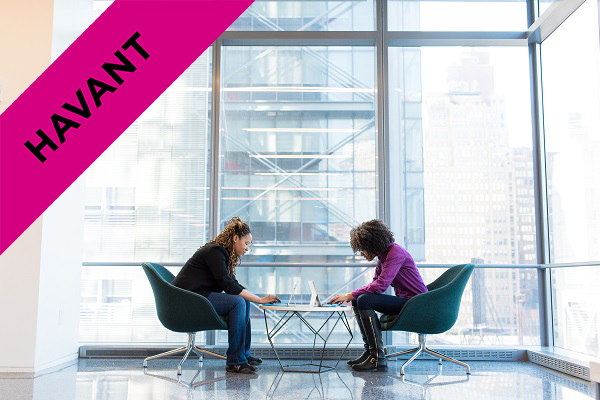 two women having a one to one meeting with laptops