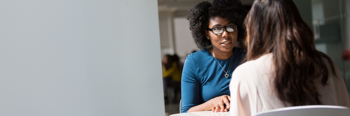 two women having a one to one meeting