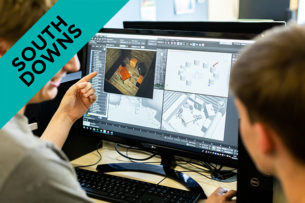 two people looking at designs on a computer screen