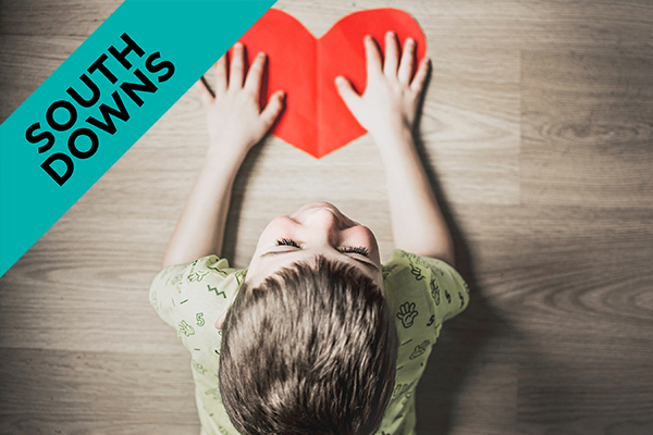a close up of a child at a table