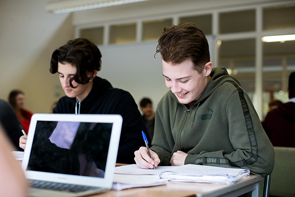 two students working together in class