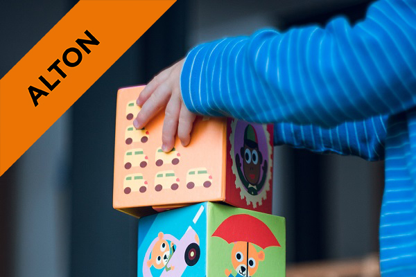 a young child playing with building blocks