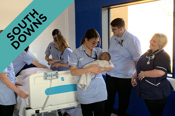 nursing t level students with a baby simulator and their nursing lecturer