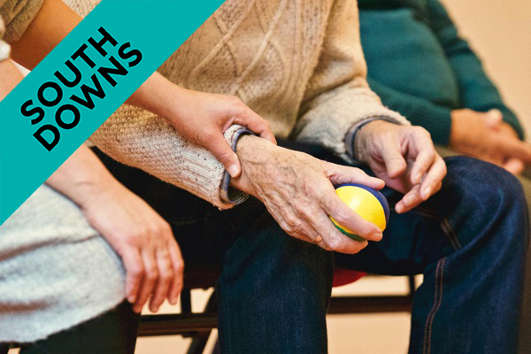 someone holding an elderly persons hands