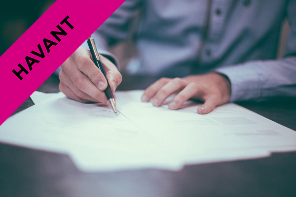 man signing a contract