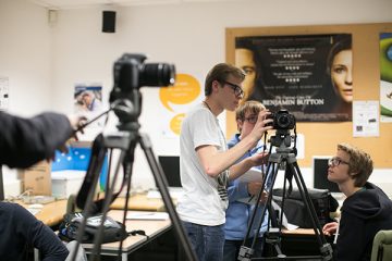 students working with camera equipment