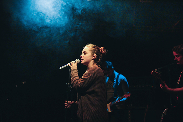 a student singing on stage