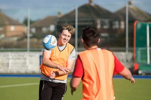 students playing rugby
