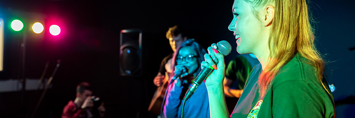 students singing and performing