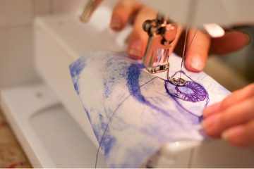 someone using a sewing machine