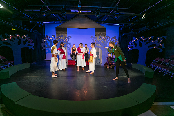 a group of students acting out a play