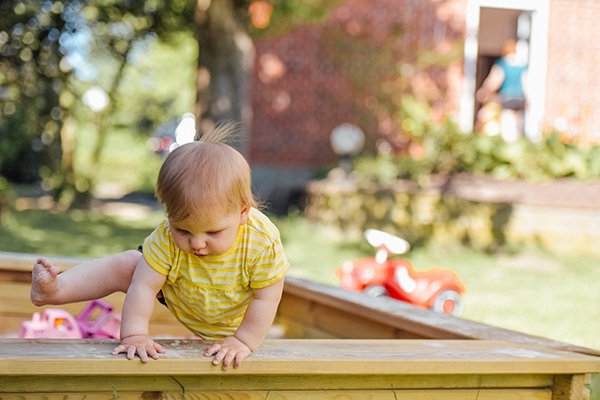 a toddler playing outside