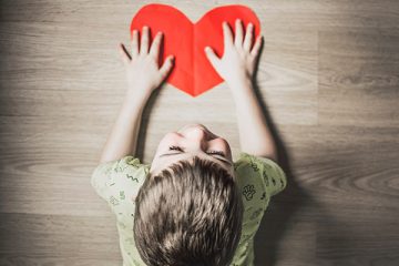 a close up of a child at a table