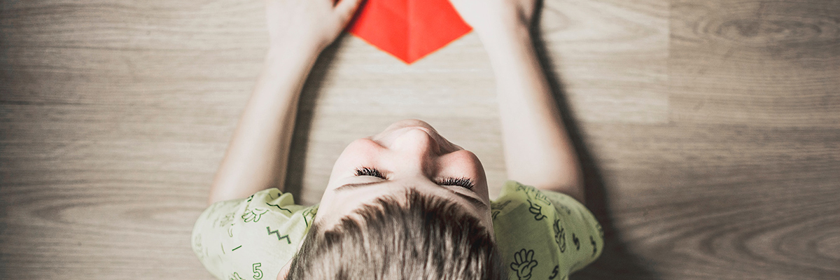 a close up of a child at a table
