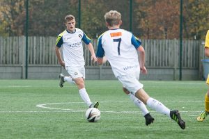 two students playing football