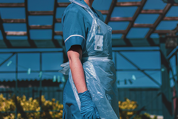 a nurse wearing a protective apron