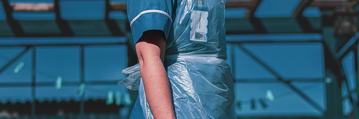 a nurse wearing a protective apron
