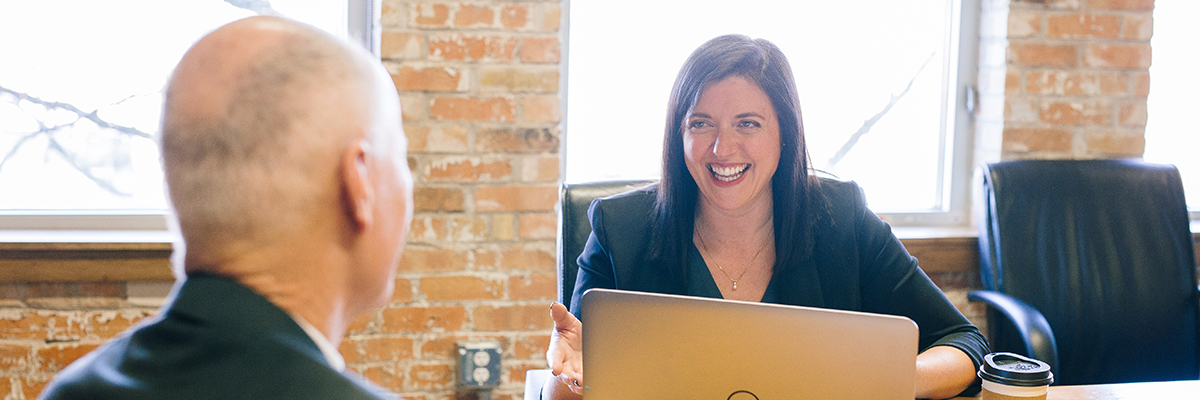 a man and a woman having a meeting