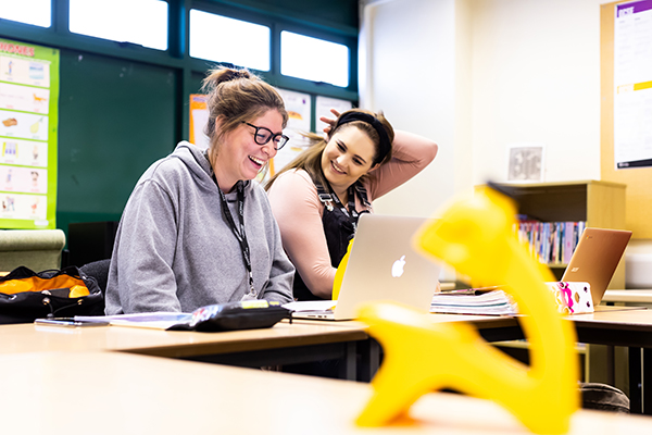 students smiling and laughing in class