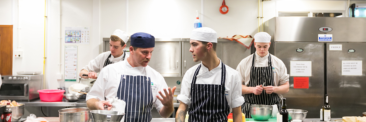 catering students in the training kitchen