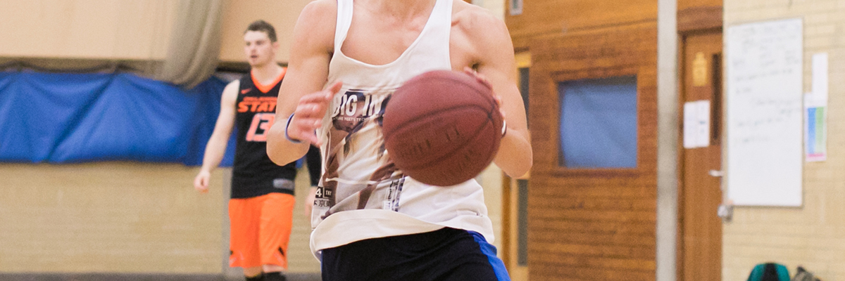 students playing basketball