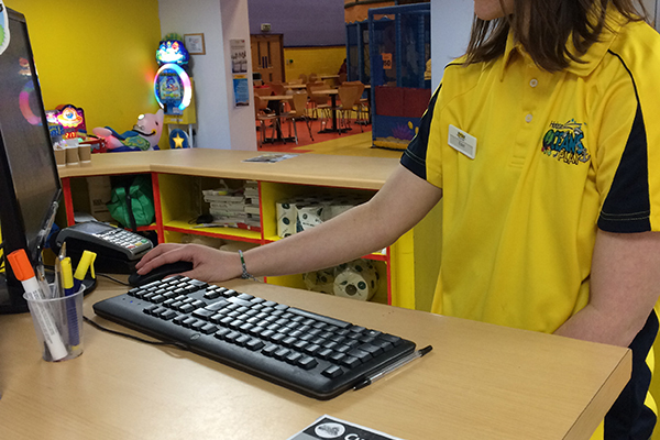 student working at a till