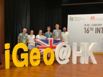 TeamUK places third in the world at iGeo standing for their photograph taken