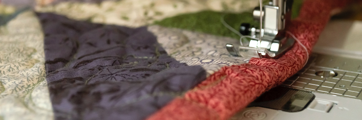 Close up of fabric going through a sewing machine during the A Level Textiles course at Alton Campus