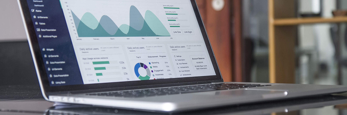 close up of a laptop displaying data graphs