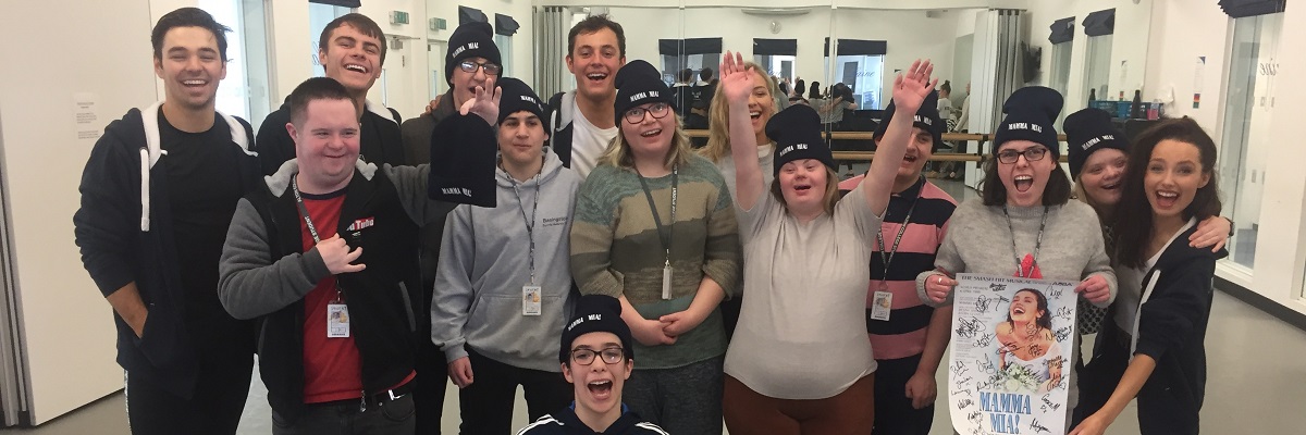 expressions creative arts students posing for a picture with cast of Mamma Mia in a dance studio