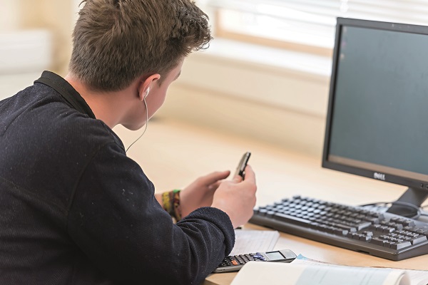 male student working at a computer