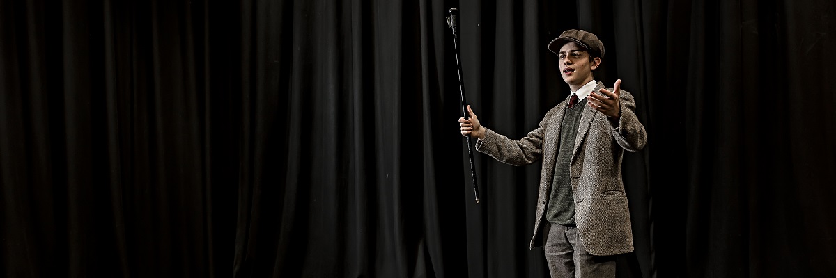 a student acting on stage