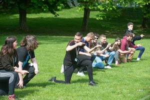 public services lecturer leading a on a field