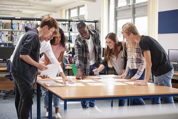 students collaborating around a table
