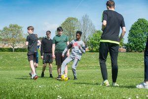 students playing football on a field