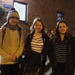 three students have their photographs taken