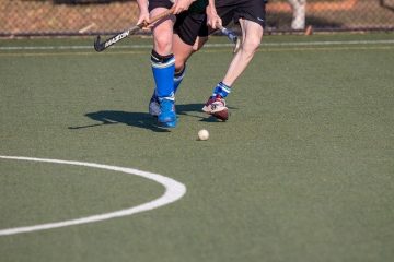 Men playing hockey