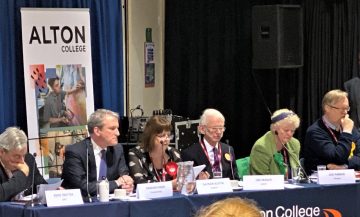 election candidates at hustings table