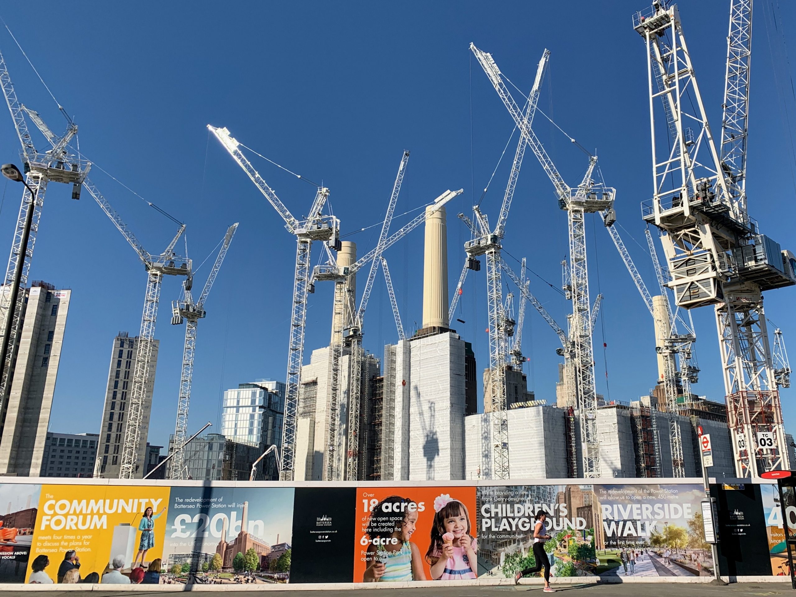 Skyline of construction cranes