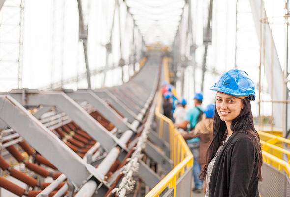 female construction worker in hard hat on site