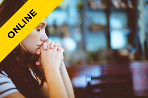 a woman with her eyes closed in deep thought