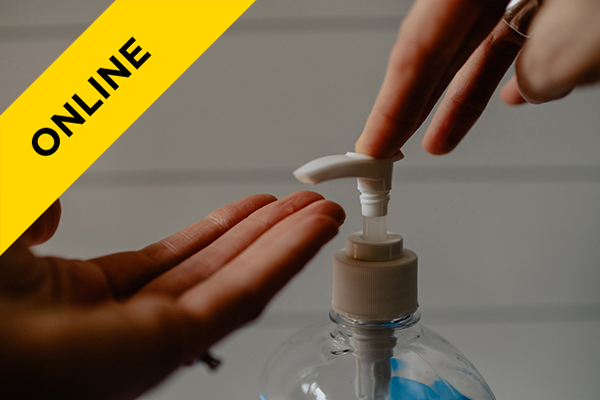 someone using a hand sanitizer dispenser