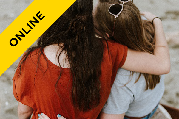 two women supporting each other with their arms around each other