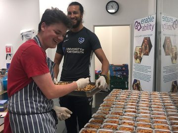 Sam and Christian posing for picture as they are preparing food 4 June 2020
