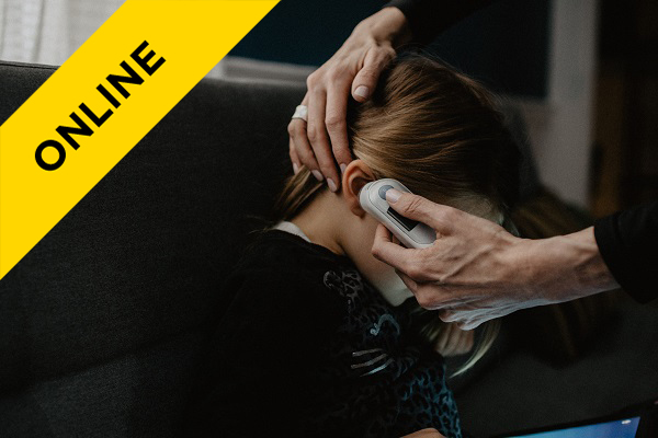 child having their ear temperature checked