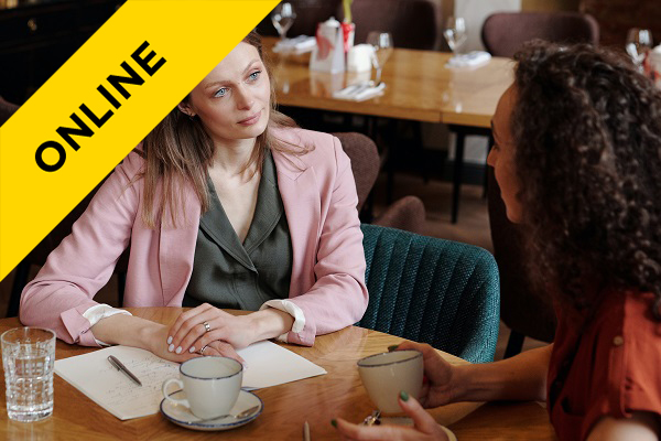 a woman listening intently to their female colleague